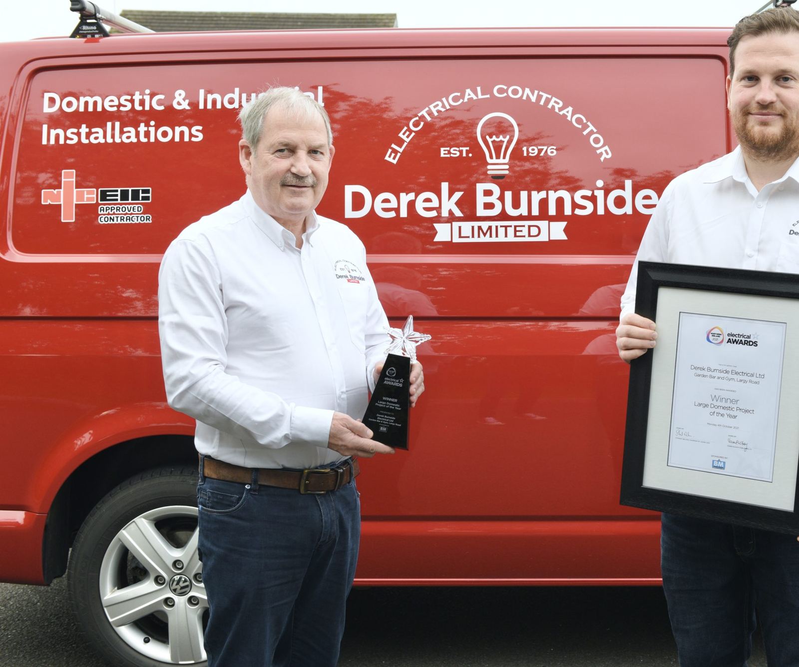 The Derek Burnside Limited team outside a company van in Ballymena